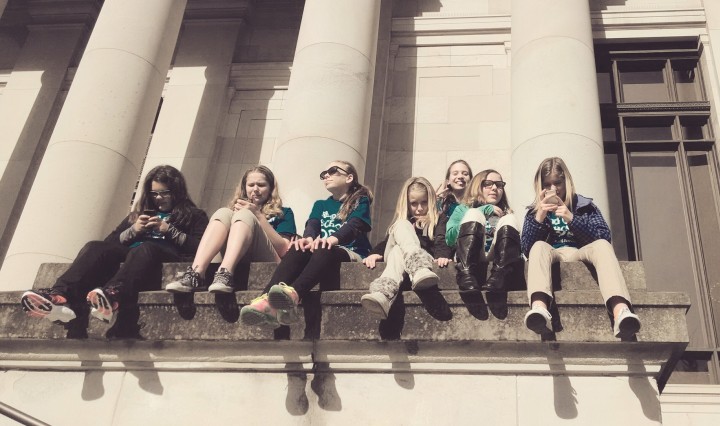 middle-school girls sit on Capitol steps
